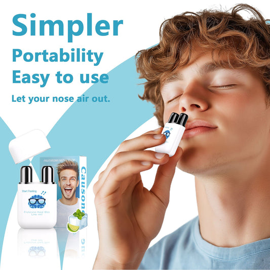 Young man inhales from pocket-sized dual hole nasal stick for quick refreshment