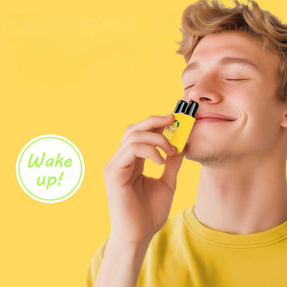 Man gently inhales from the compact travel aromatherapy inhaler for refreshment