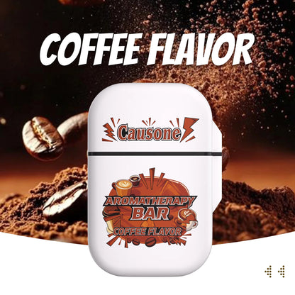 Coffee scent aromatherapy nasal inhaler case set against coffee beans and powder backdrop