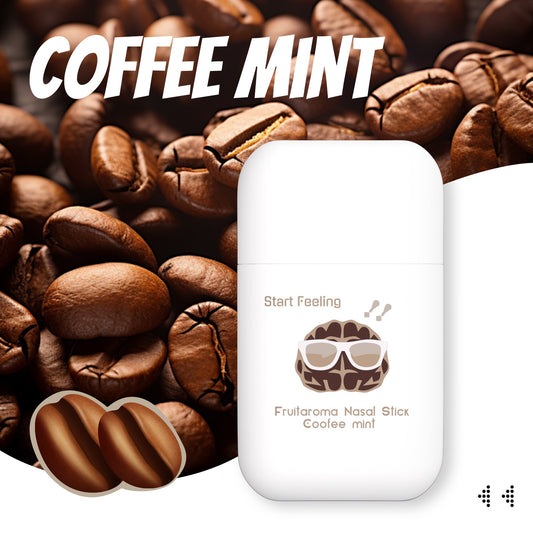 Portable dual nozzle nasal stick with coffee mint scent placed among roasted coffee beans