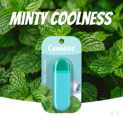 Lime mint flavor portable breath freshening stick with retail packaging against fresh mint leaves