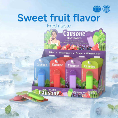 Retail display box filled with assorted fruit mint breath freshening sticks set on icy surface