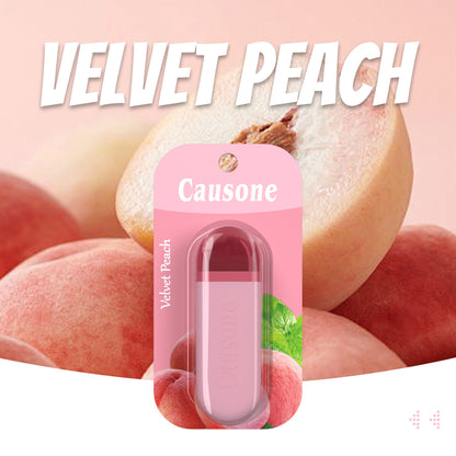 Velvet peach flavor pocket breath freshener stick surrounded by ripe fresh peaches