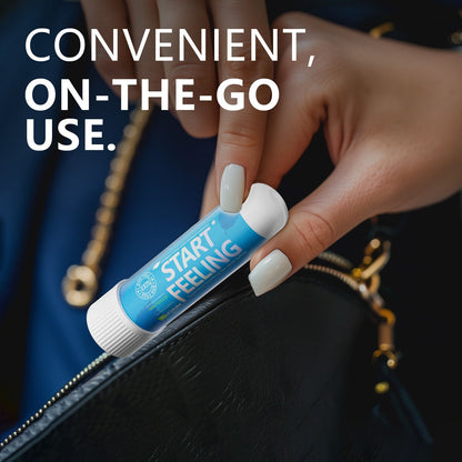 Mini single nasal inhaler held between fingers for easy on-the-go carrying